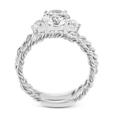 Wrap this ring around your finger for a distinctive style statement sure to stand the test of time- yellow and white 18k gold twisted together with .24 ctw of white diamond side stones.