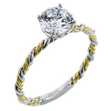 Two tones of 18k gold twist around each other in this contemporary yet timeless engagement ring.