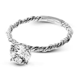 Two tones of 18k gold twist around each other in this contemporary yet timeless engagement ring.