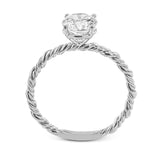 Two tones of 18k gold twist around each other in this contemporary yet timeless engagement ring.