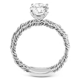 Two tones of 18k gold twist around each other in this contemporary yet timeless engagement ring.