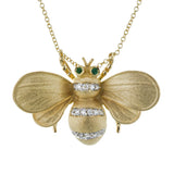 18K YG bee pendant has a brushed textured finish with 0.12 ctw diam and .02 ctw emeralds for eyes on an 18 chain