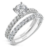 This engagement ring is sure to shine, with a classic straight design set with .49 ctw of white side diamonds.