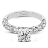 This engagement ring is stunning from every side, with .97 ctw of white round diamonds on the top and sides of the ring.