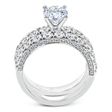 This engagement ring is stunning from every side, with .97 ctw of white round diamonds on the top and sides of the ring.