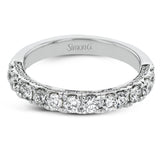 This engagement ring is stunning from every side, with .97 ctw of white round diamonds on the top and sides of the ring.