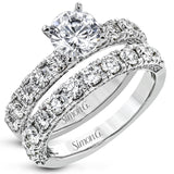 This engagement ring is stunning from every side, with .97 ctw of white round diamonds on the top and sides of the ring.