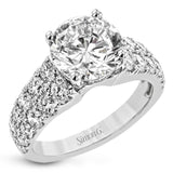 This bold engagement ring contains 1.50 ctw of side diamonds and will be sure to draw anyone's eyes with its modern design.