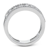 Baguette diamonds stand to attention and create and architectural effect in this unique 18k white gold ring design.