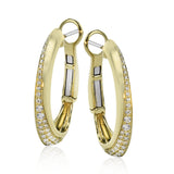 These dynamic 18k yellow gold hoop earrings contain .27 ctw of white diamonds along the exterior of their distinctive shape.
