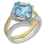 This one of a kind color ring stuns in two-tone gold with a split shank diamond band 0.46 ctw, and a paraiba tourmaline center 3.20 ctw