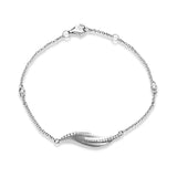 This nature-inspired 18k white gold bracelet contains .20 ctw of diamonds in a leaf design.
