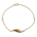 This nature-inspired 18k yellow gold bracelet contains .20 ctw of diamonds in a leaf design.