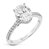 This 18k white gold engagement ring is perfect for an oval center stone, accented by .32 ctw of white diamonds.