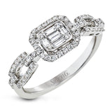 Vintage inspired yet modern, this white gold ring features a central emerald shaped mosaic of diamonds and a striking chain-like design on the band.