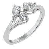 Our modern update on the three stone ring, this piece features a round, pear, and oval diamond brought together in a stunning design.