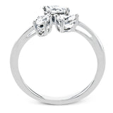 Combining old and new, this fresh take on a three stone ring contains a .15 ct pear shaped diamond, a .16 ct marquise cut diamond and a .15 oval cut diamond.