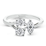 This ring design transforms the concept of three-stone, with two oval diamonds and a larger marquise shaped diamond set in a geometric shape.