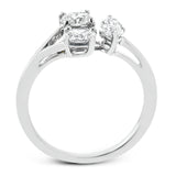 This ring design transforms the concept of three-stone, with two oval diamonds and a larger marquise shaped diamond set in a geometric shape.