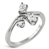 This new take on a three stone design features a .15 ct pear shaped diamond and .43 ctw oval diamonds in a cluster.