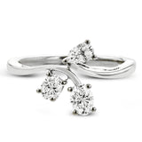 This new take on a three stone design features a .15 ct pear shaped diamond and .43 ctw oval diamonds in a cluster.