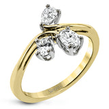 This new take on a three stone design features a .15 ct pear shaped diamond and .43 ctw oval diamonds in a cluster.