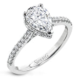 A hidden underhalo of brilliant diamonds reveals itself when this ring is turned to side, diamonds shining from every angle.