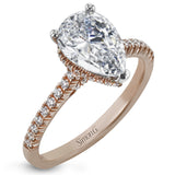 A hidden underhalo of brilliant diamonds reveals itself when this ring is turned to side, diamonds shining from every angle.