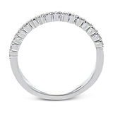 This wedding set stands apart with a unique design featuring two tapered baguette side stones on either side of the center stone, along with .43 ctw of round white accent diamonds.