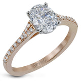 Simple yet stunning, this graceful engagement ring is made for an oval cut center stone and is set with .16 ctw of white diamonds.
