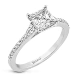 Simple yet stunning, this graceful engagement ring is made for a princess cut center stone and is set with .16 ctw of white diamonds.