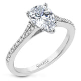 Simple yet stunning, this graceful engagement ring is made for a pear cut center stone and is set with .16 ctw of white diamonds.
