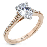 Simple yet stunning, this graceful engagement ring is made for a pear cut center stone and is set with .16 ctw of white diamonds.