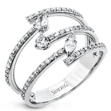 This geometric ring showcases .43 ctw of round diamonds, .08 ctw marquise accents, and one .07 ct of pear shaped diamond.