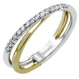 This overlapping two-tone 18k gold ring has a modern look with .15 ctw of white diamonds.