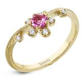 This 18k yellow gold ring provides the ideal sparkle with a .28 ct spinel and .09 ctw of white diamonds.
