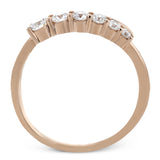 This dynamic 18k gold ring adds the perfect accent to any outfit with .38 ctw of diamonds in a graduated line. This ring can be worn alone or interlocked with its white gold counterpart to create a bold statement.
