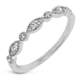 This ring is perfect for stacking with a distinctive design set with  .20 ctw of diamonds.