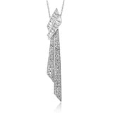 Dress up any outfit with this asymmetric diamond pendant which features straight baguettes 0.79 ctw and round brilliant diamonds 0.82 ctw