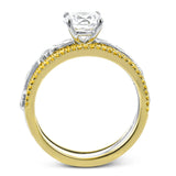 This beautiful two-tone 18k gold wedding set features an organic design white gold inner ring, with a yellow gold jacket surrounding it that is set with .22 ctw of yellow diamonds.