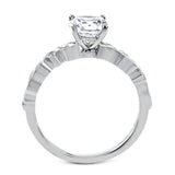 This beautiful two-tone 18k gold wedding set features an organic design white gold inner ring, with a yellow gold jacket surrounding it that is set with .22 ctw of yellow diamonds.
