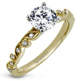 This beautiful two-tone 18k gold wedding set features an organic design white gold inner ring, with a yellow gold jacket surrounding it that is set with .22 ctw of yellow diamonds.