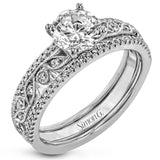 This beautiful two-tone 18k gold wedding set features an organic design white gold inner ring, with a yellow gold jacket surrounding it that is set with .22 ctw of yellow diamonds.