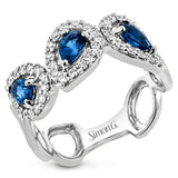This modern 18K white gold fashion ring features .47cttw diamonds and .80cttw sapphires.