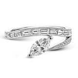 Baguette diamonds and milgrain details in white gold enhance the marquise center stone set at an angle in this dynamic Lightning Collection ring.