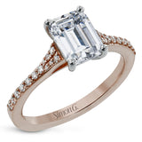 Simple yet stunning, this graceful engagement ring is made for an emerald cut center stone and is set with .16 ctw of white diamonds.