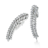 Vintage vibes for days, these 18k white gold earrings showcase 3.31cttw diamonds.