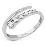 This dynamic 18k gold ring adds the perfect accent to any outfit with .38 ctw of diamonds in a graduated line.