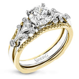 This two-tone gold wedding set features a white gold engagement ring that nestles perfectly into the yellow gold guard that is set with .20 ctw of yellow diamonds.