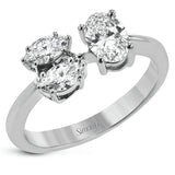 In this contemporary take on a classic three stone ring, one larger oval shaped diamond and two smaller marquise diamonds are set together in a stylish cluster design.